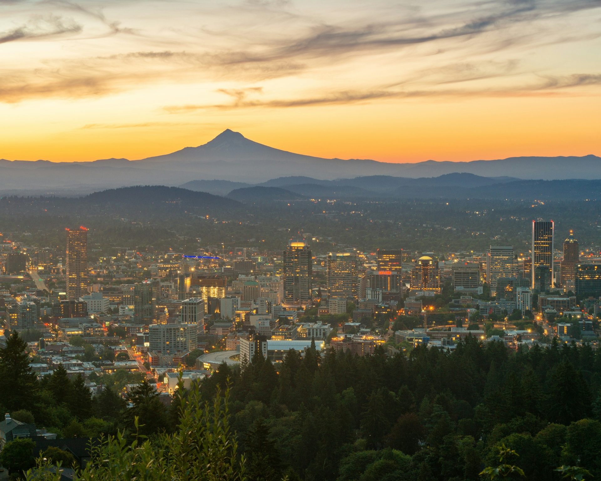 Portland, Oregon skyline at sunset with Mount Hood in the distance